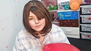 Girl Blowing up 3 huge balloons